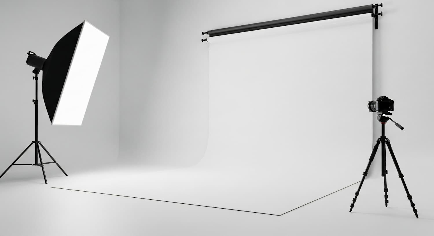 Empty photo studio with a softbox light and a camera on a tripod
